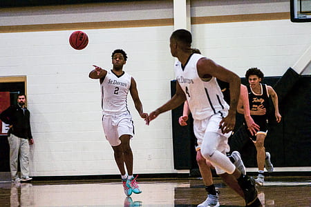 men playing basketball on basketball court thumbnail