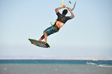 man standing on surfboard during daytime thumbnail