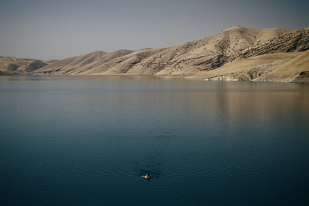 person swimming in blue water thumbnail