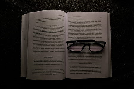 eyeglasses on book body thumbnail