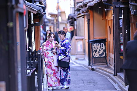 two women standing on alley thumbnail