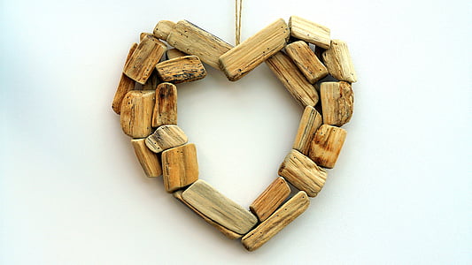 brown wooden heart cutout pendant with white background thumbnail