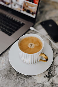 Coffee in a cup on a marble desk thumbnail
