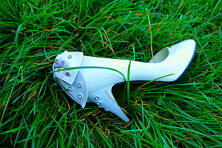 white leather pointed-toe heeled shoe on grass thumbnail