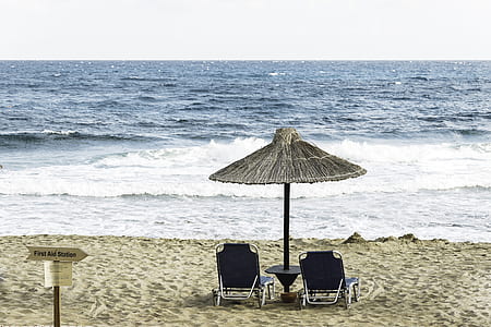 two beach chairs under patio thumbnail