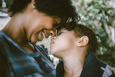 woman and boy sticking their nose to each other thumbnail
