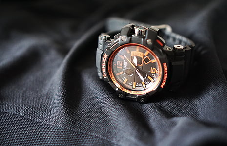 close-up photo of orange analog watch displaying 2:39 thumbnail