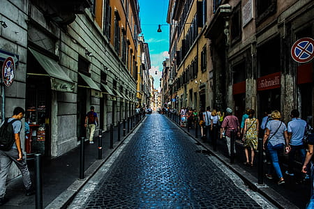 People Walking on Sidewalk Beside Road thumbnail