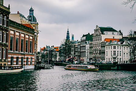 Boat On The Water Near Buildings thumbnail