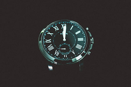 round silver-colored chronograph watch reading at 12:00 thumbnail