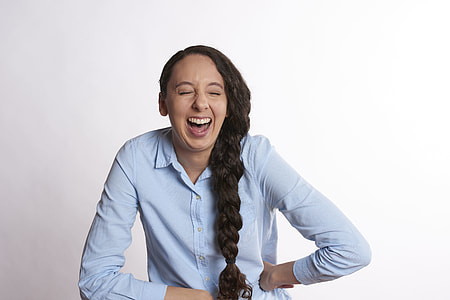 woman in white dress shirt smiling thumbnail