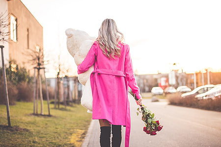 Woman with Big Teddy and Roses Walking on the Street thumbnail