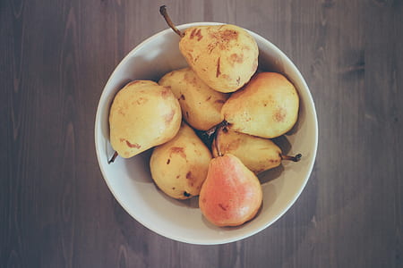 pears on white ceramic bowl thumbnail