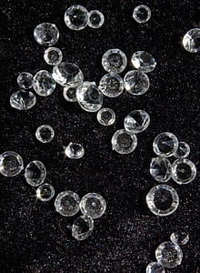 clear gemstones on black surface thumbnail
