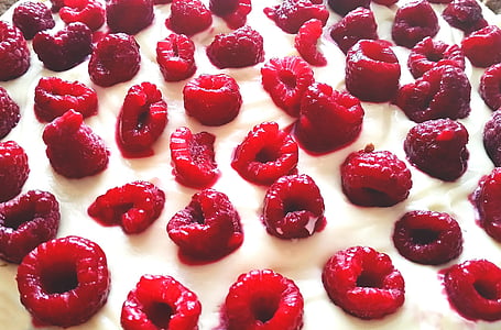 white frosting topped with raspberries thumbnail