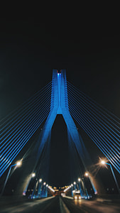 vehicle on bridge during nighttime thumbnail