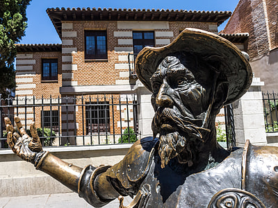 close photo of man wearing copper armor and hat statue thumbnail