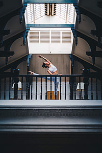 woman in white crop top and pants doing ballet thumbnail