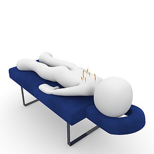 human figure lying on blue massage bed thumbnail
