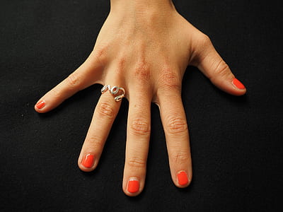 person showing silver-colored ring thumbnail