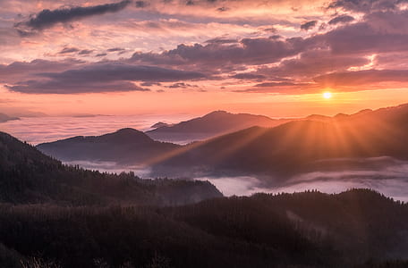 foggy mountain during sunset thumbnail