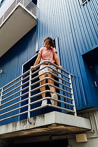woman standing on rail thumbnail