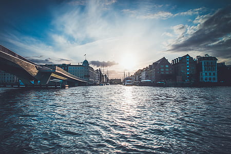 concrete building near body of water at daytime thumbnail