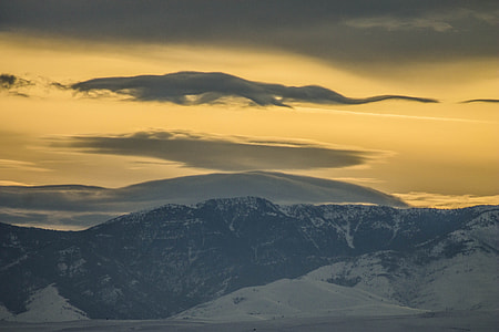 black and white mountain under sky long exposure photography thumbnail