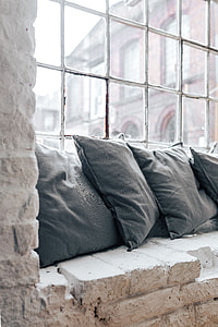 Collection of grey and white pillows thumbnail