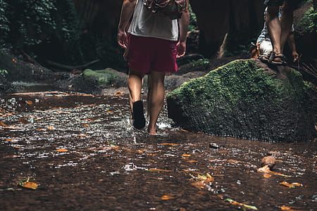 men walking near boulders thumbnail