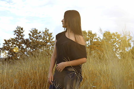 woman standing on green grass thumbnail