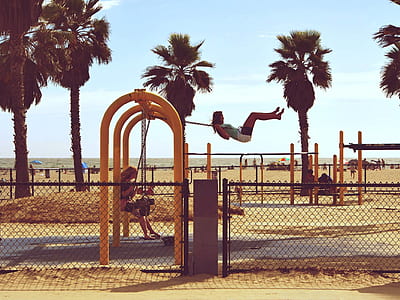Woman Playing Swing Near Beach thumbnail