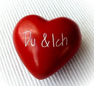 red heart figurine against white surface thumbnail