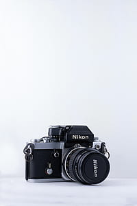 black and grey Nikon DSLR camera thumbnail