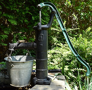 black water hand pump and gray bucket thumbnail
