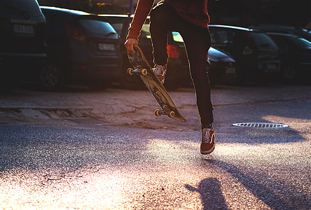 person jumping on skateboard during daytime thumbnail
