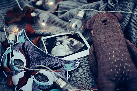 ultrasound result with light bulb and brown bear plush toy in bokeh photography thumbnail