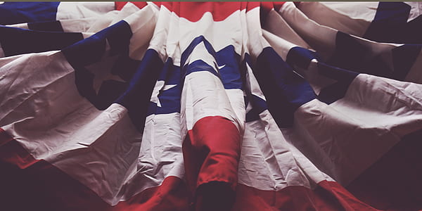 white and blue flag in closeup photography thumbnail