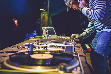 man setting DJ controller thumbnail