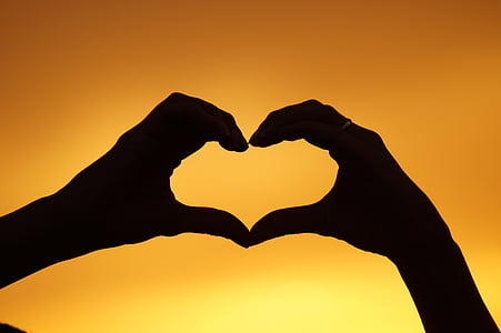 silhouette of two hands forming heart thumbnail