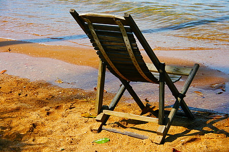brown adirondack chair on seashore thumbnail