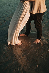engagement photography of man and woman barefooted on mud thumbnail