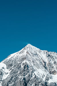 mountain covered with snow during daytime thumbnail