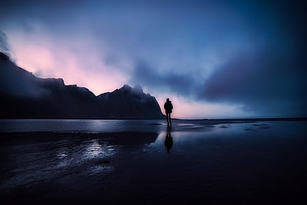 silhouette of person on body of water thumbnail
