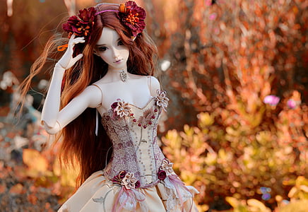 girl with red hair wearing beige and purple dress doll thumbnail