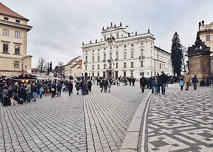 people walking on road near buildings thumbnail