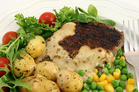 cooked dish in white ceramic plate beside silver-colored fork thumbnail