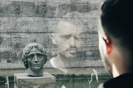 man looking on gray concrete headbust thumbnail