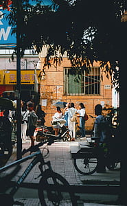 people near two bicycles thumbnail