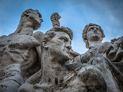 three men statues under blue sky thumbnail
